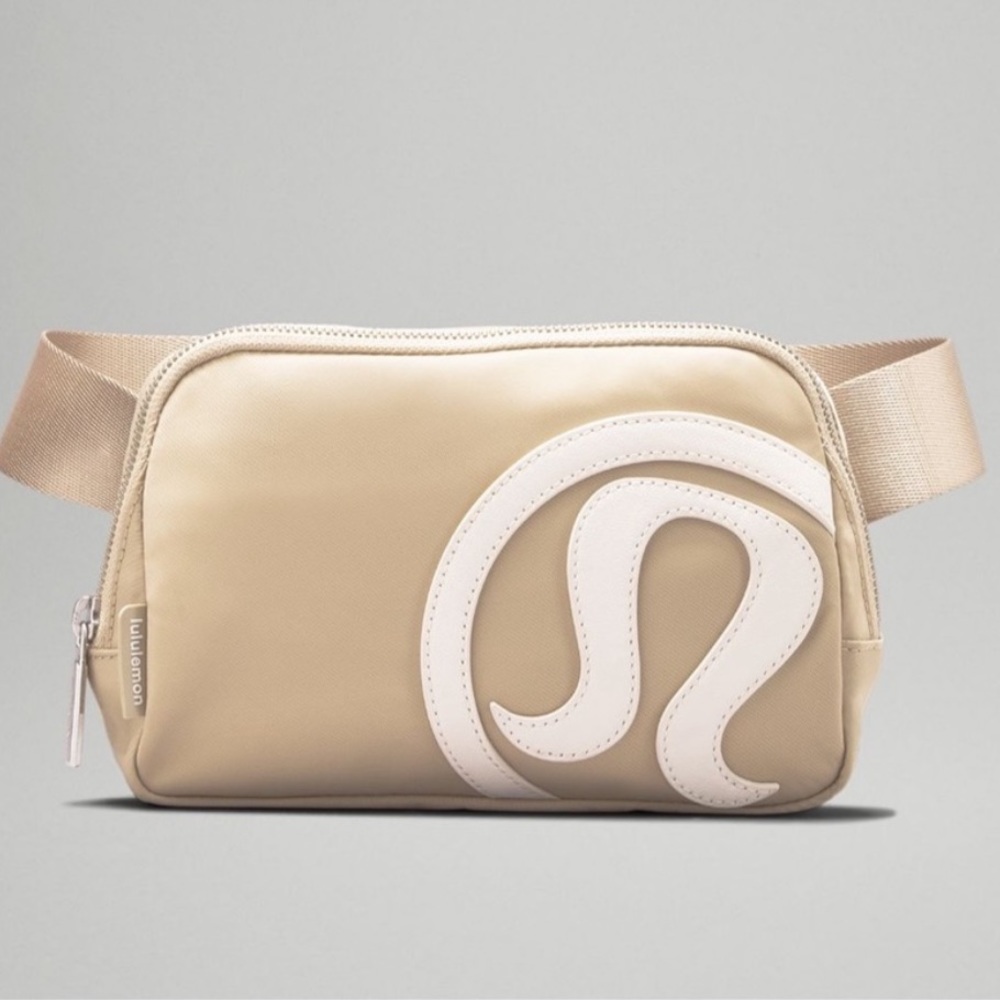 LULULEMON NWTs tan and white everywhere belt bag with white cut out raised logo